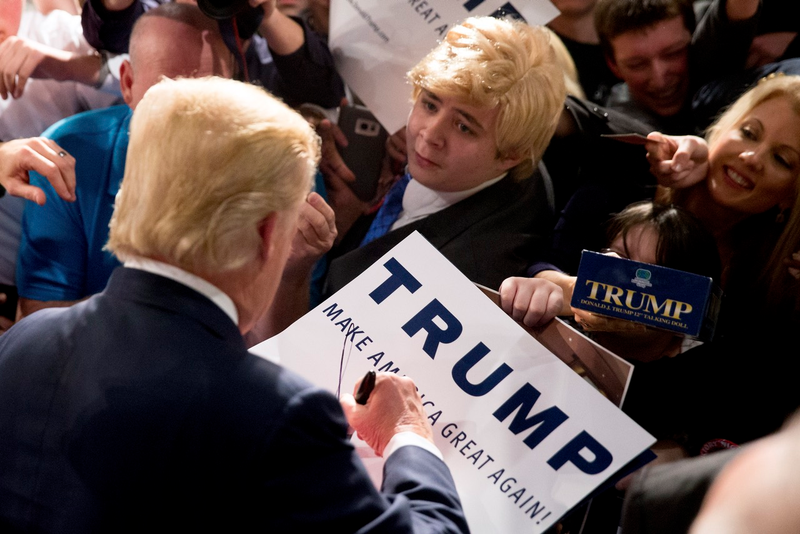 Young Trump supporter trying to speak with the man himself (AP Photo/Andrew Harnik)